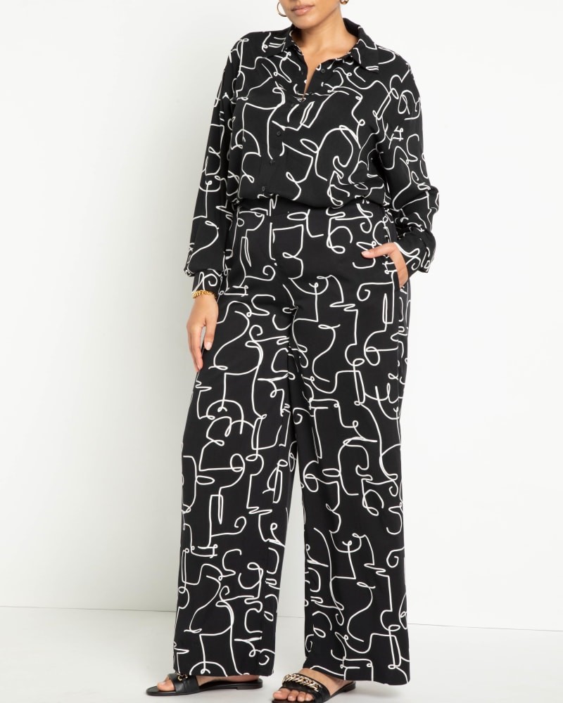 Front of a model wearing a size 20 Printed Wide Leg Pant in Dandy Doodle - Black + White by ELOQUII. | dia_product_style_image_id:292790